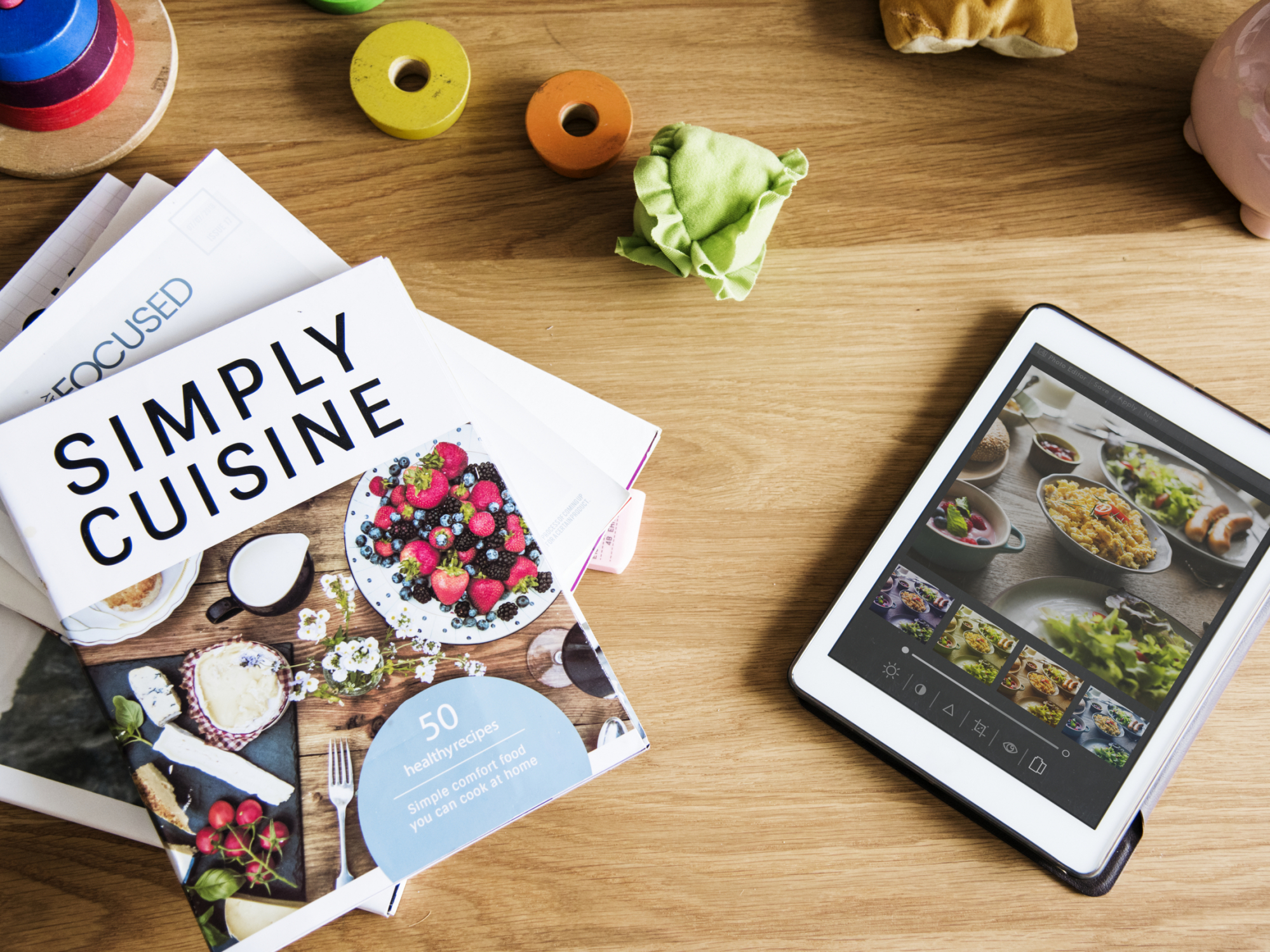 Tablet and magazines on table